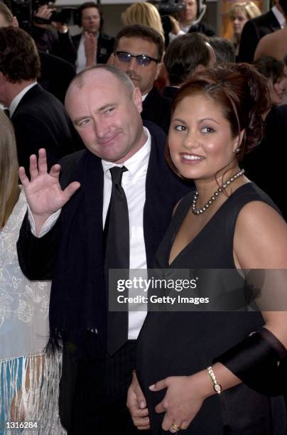 Singer Phil Collins and his wife Orianne, who is pregnant, arrive at the 58th annual Golden Globes January 21, 2001 at the Beverly Hilton Hotel in...