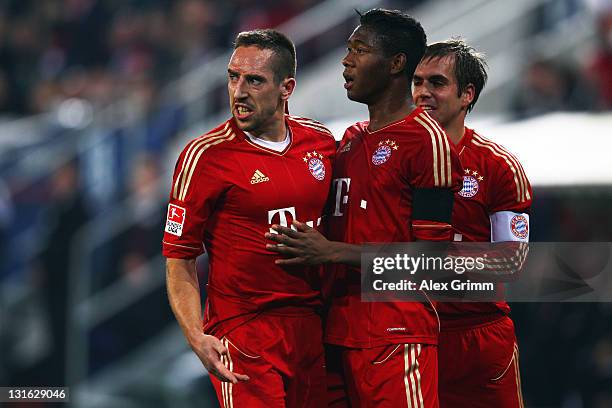 Franck Ribery of Muenchen celebrates his team's second goal with team mates David Alaba and Philipp Lahm during the Bundesliga match between FC...
