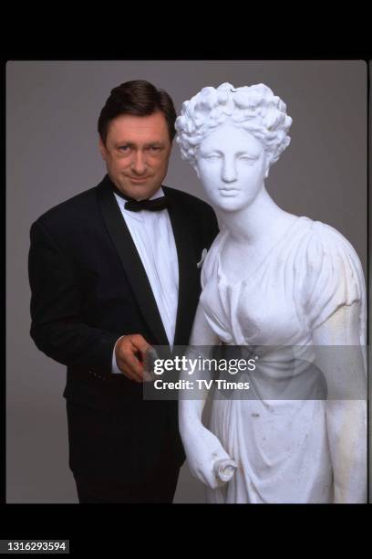 Television presenter and gardening journalist Alan Titchmarsh posed as James Bond, circa 1999.