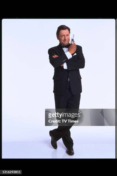 Television presenter and gardening journalist Alan Titchmarsh posed as James Bond, circa 1999.