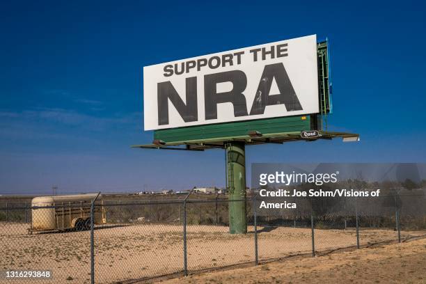 National Rifle Association, sign promotes membership of NRA, Texas.