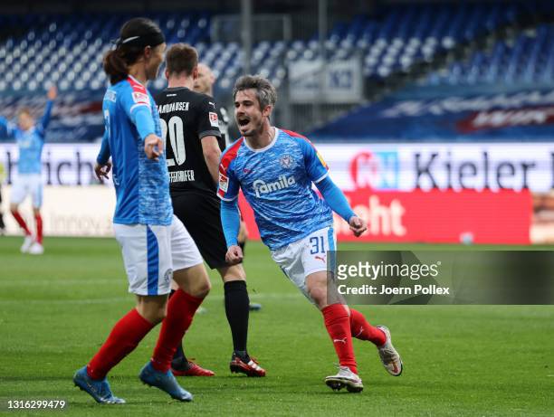 Fin Bartels of Holstein Kiel celebrates after scoring his team's first goal during the Second Bundesliga match between Holstein Kiel and SV...