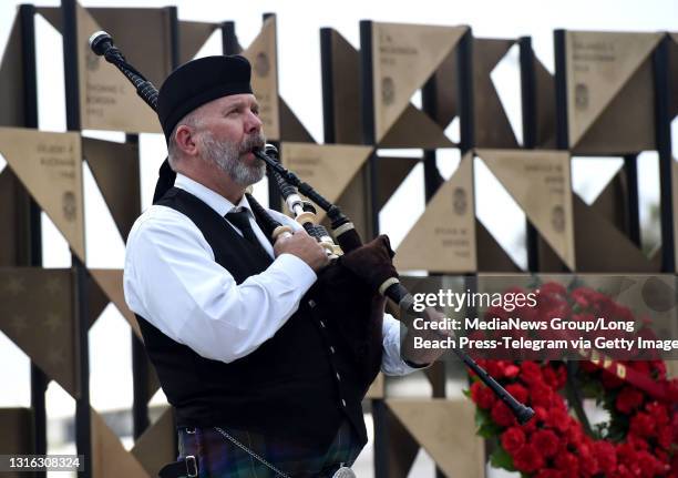 Amazing Grace is played on bagpipes as police and fire personnel gathered to pay tribute to the 29 police employees and 14 firefighters who have lost...