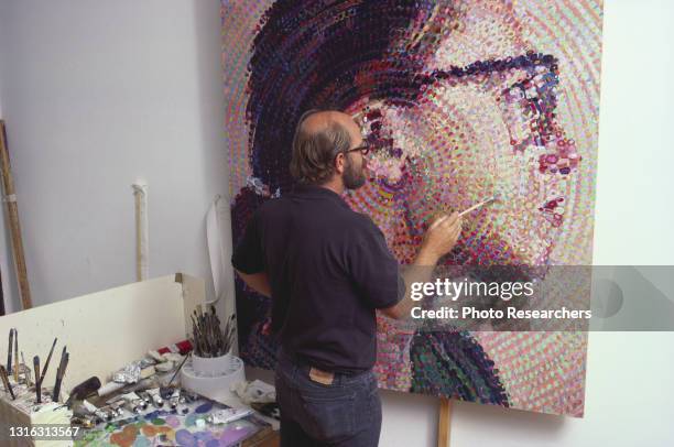 American artist Chuck Close works on his painting 'Cindy II' in his studio, New York, New York, 1988. Later in the year, he suffered a catastrophic...