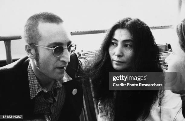 View of married musicians John Lennon and Yoko Ono during a boat party hosted by Ms magazine, New York, New York, 1974.