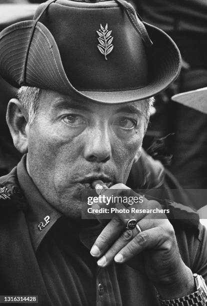 View of Panamanian leader Omar Torrijos as he smokes a cigar, Panama, 1980.