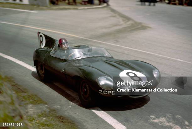 Duncan Hamilton in the private Jaguar D-Type which he shared with Ivor Bueb, they were eliminted by an accident late in the race, Le Mans 24 Hours.
