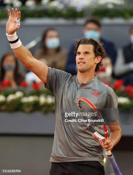 Dominic Thiem of Austria celebrates victory in his mens singles match against Marcos Giron of The United States during day six of the Mutua Madrid...