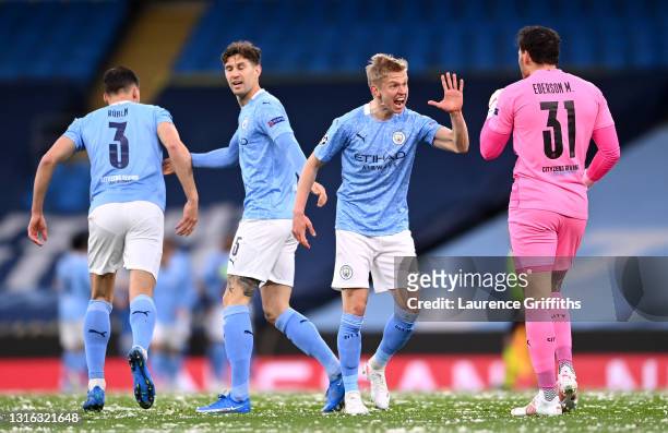 Oleksandr Zinchenko of Manchester City celebrates his side's first goal which came from a Riyad Mahrez goal with Ederson of Manchester City during...