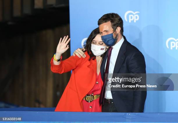 The president of the Community of Madrid and candidate for re-election by the PP, Isabel Diaz Ayuso; and the leader of the PP, Pablo Casado, greet to...
