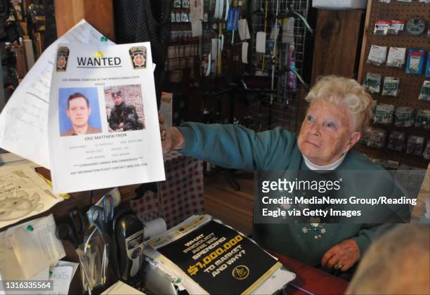 State Police Shooting Photo by Bill Uhrich 9/19/2014 Alyce Smith, who co- owns Smitty's Sporting Goods in Canadensis with her husband Roger, shows a...