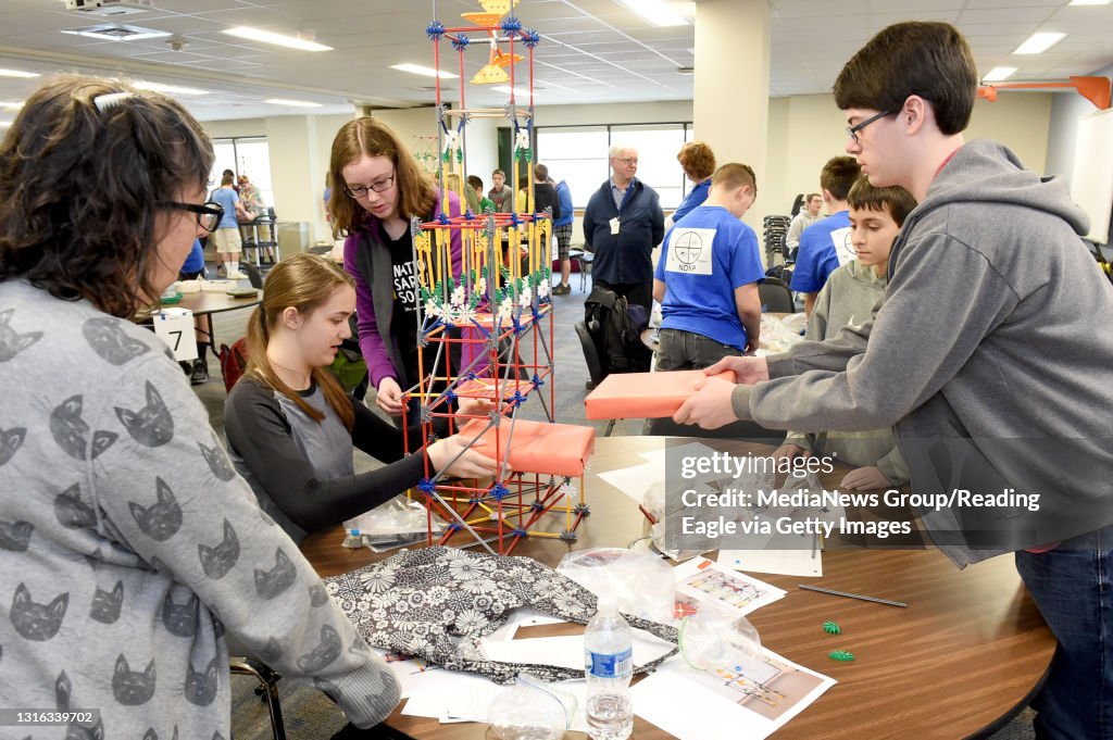 A STEM competition among middle and junior high school students using K'Nexs. The Fortuitous Four team from Antietam Junior High includes, from left, Melissa Faro, gifted education teacher; Anna Randolph, 13, 8th grade of Lower Alsace Township; Allison Si