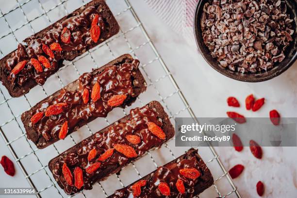 vegan chocolate protein bars with goji berries - wolfberry stock pictures, royalty-free photos & images