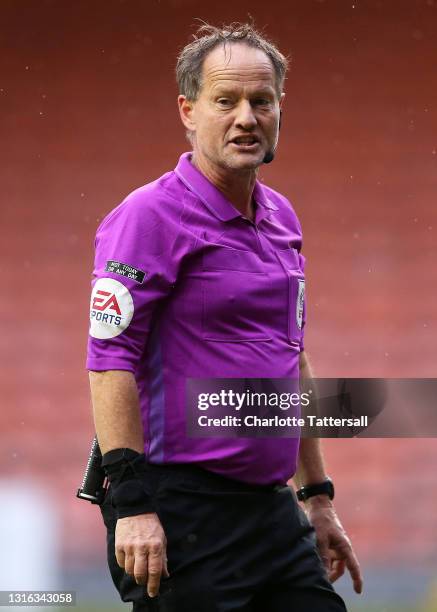 Referee Robert Lewis reacts during the Sky Bet League One match between Blackpool and Doncaster Rovers at Bloomfield Road on May 04, 2021 in...