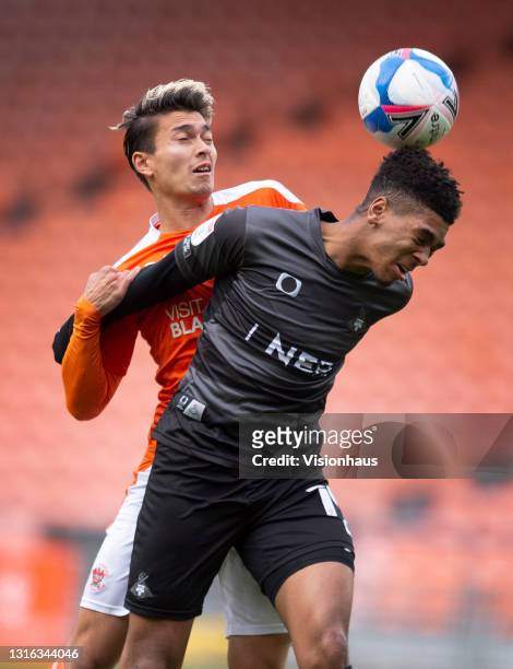 Kenneth Dougall of Blackpool and Tyreece John-Jules of Doncaster Rovers in action during the Sky Bet League One match between Blackpool and Doncaster...