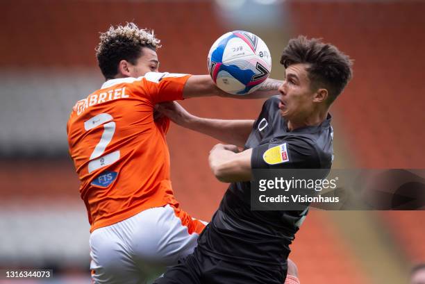 Jordan Gabriel of Blackpool and Branden Horton of Doncaster Rovers in action during the Sky Bet League One match between Blackpool and Doncaster...