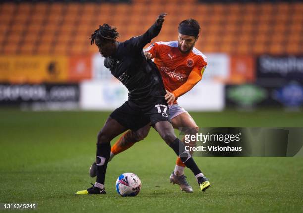 Luke Garbutt of Blackpool and Taylor Richards of Doncaster Rovers in action during the Sky Bet League One match between Blackpool and Doncaster...