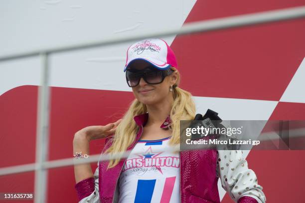 Paris Hilton of the USA poses on the podium at the end of the 125 cc race of MotoGP of Valencia at Ricardo Tormo Circuit on November 6, 2011 in...