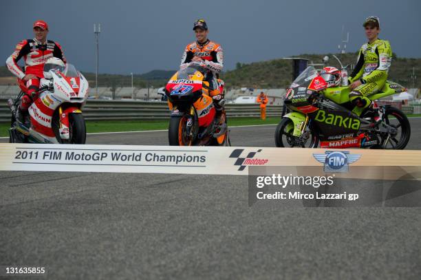 MotoGP World Champions: Stefan Bradl of Germany and Viessmann Kiefer Racing, Casey Stoner of Australia and Repsol Honda Team and Nicolas Terol of...