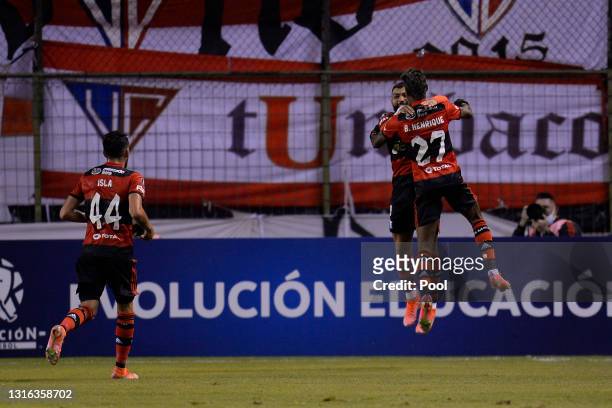 Bruno Henrique of Flamengo celebrates with teammates after scoring the second goal of his team during a match between LDU and Flamengo as part of...