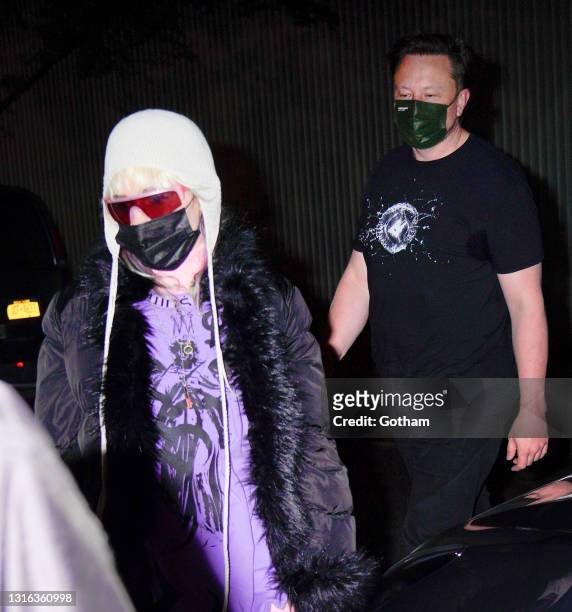 Elon Musk and his girlfriend Grimes head for dinner on May 04, 2021 in New York City.