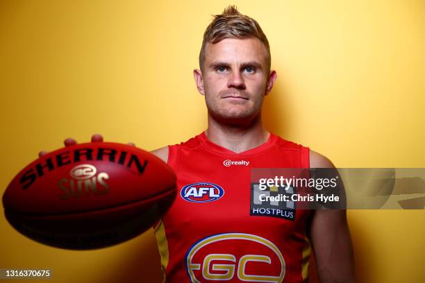 Brandon Ellis of the Suns poses ahead of his 200th match at Metricon Stadium on May 05, 2021 in Gold Coast, Australia.