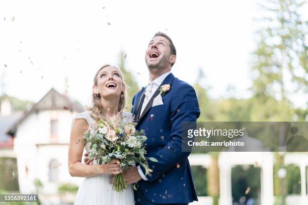 very happy wedding couple after ceremony outdoors in summer - fairytale wedding stock pictures, royalty-free photos & images