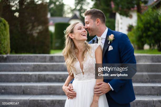 beautiful newlywed happy couple in wedding outfits - bride smiling stock pictures, royalty-free photos & images