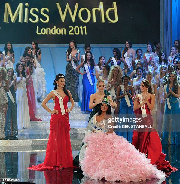 Miss Venezula, Ivian Sarcos, is crowned by Miss World 2010, Alexandria Mills of the United States, after winning Miss World 2011 at Earls Court in...