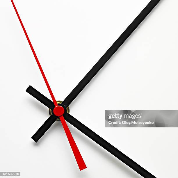 white clock dial with black and red hands - clock hand stock pictures, royalty-free photos & images