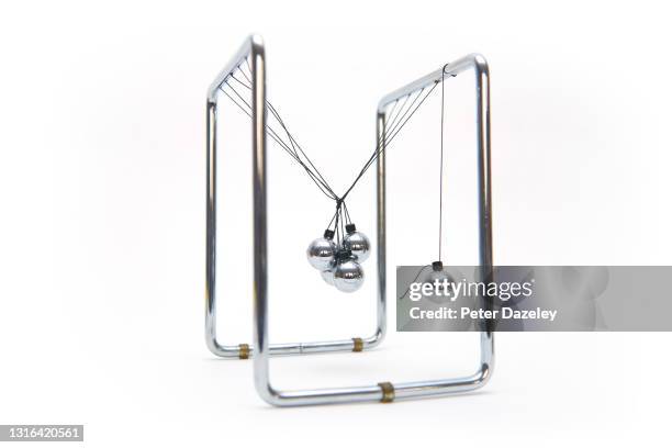 damaged newton's cradle - broken toy stock pictures, royalty-free photos & images