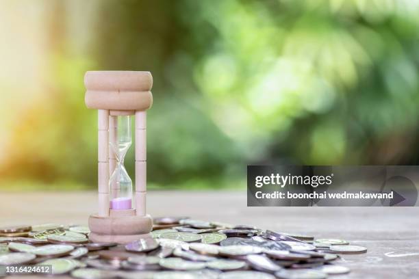 deadline and time is money concept with hourglass and coin - time blocking stock pictures, royalty-free photos & images