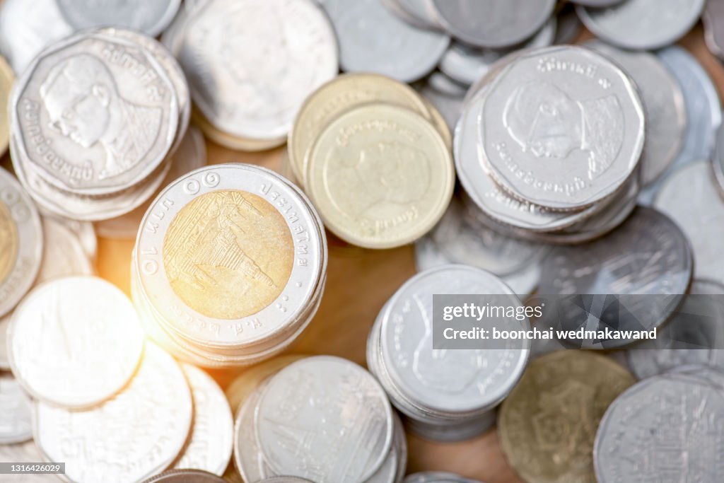 Close-up of many different type of Thai baht coins.