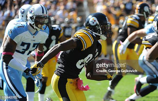 Kick returner Antonio Brown of the Pittsburgh Steelers is pursued by defensive back Tommie Campbell of the Tennessee Titans during a game at Heinz...