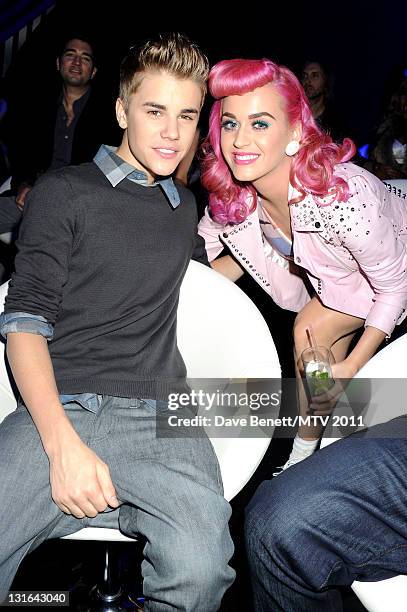 Singers Justin Bieber and Katy Perry pose in the VIP Glamour area during the MTV Europe Music Awards 2011 at Odyssey Arena on November 6, 2011 in...
