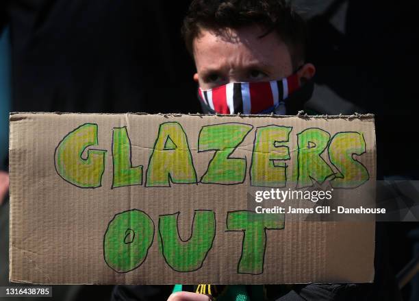 Manchester United supporters protest against the Glazer ownership during a protest against the club's ownership, outside Old Trafford on April 24,...