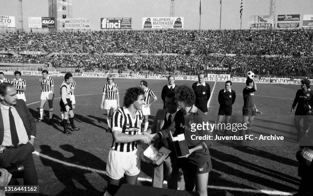 Juventus player Antonio Cabrini with Falcao reciving a prize before Juventus - Roma on november 01, 1981 in Turin, Italy.