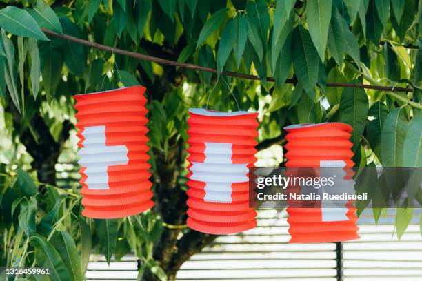 celebrating swiss national holiday on the 1st of august with paper lanterns. - fiesta nacional fotografías e imágenes de stock