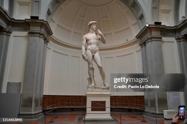 The original statue of Michelangelo's David with a new less invasive fence to allow a better viewing of Michelangelo's masterpiece on May 05, 2021 in...