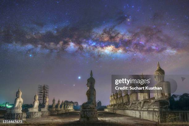 milky way rising above big buddha statue at niranam temple, nakhon si thammarat, thailand. - deep relaxation stock pictures, royalty-free photos & images