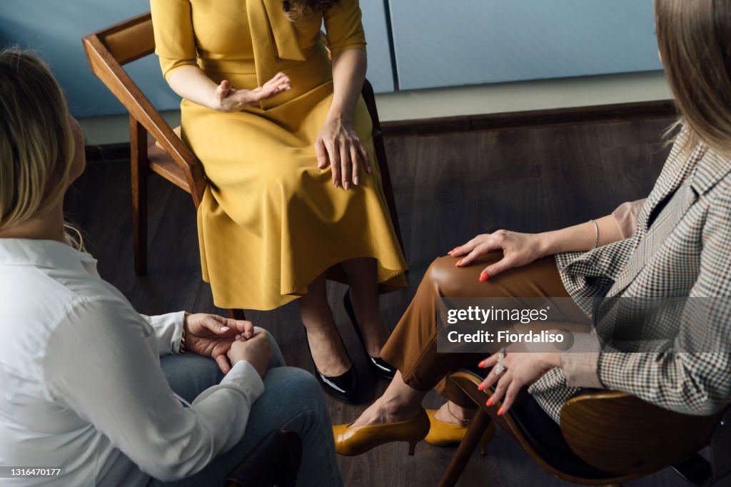 Three business women talking in the office