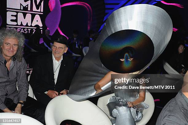 Brian May of Queen, Manager of Queen Jim Beach and Lady Gaga poses in the VIP Glamour area during the MTV Europe Music Awards 2011 at Odyssey Arena...