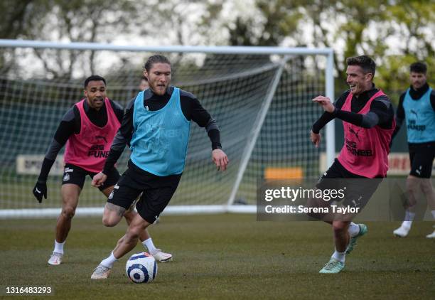 Jeff Hendrick controls the ball as Callum Wilson and Ciaran Clark defend during the Newcastle United Training Session at the Newcastle United...