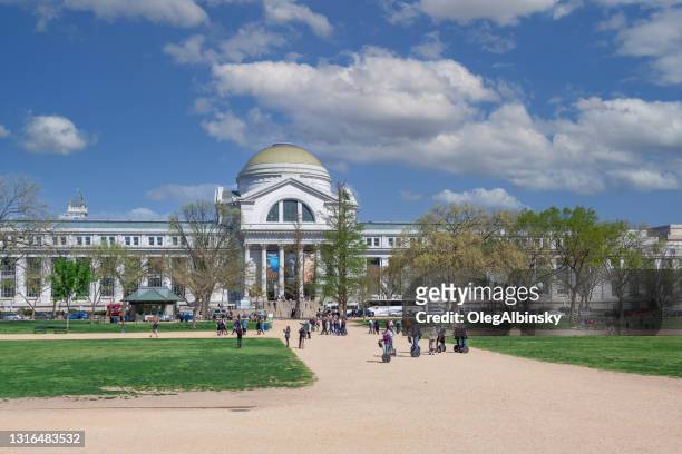 smithsonian museum of natural history and blue sky with puffy clouds, washington dc. - national museum of natural history washington stock pictures, royalty-free photos & images