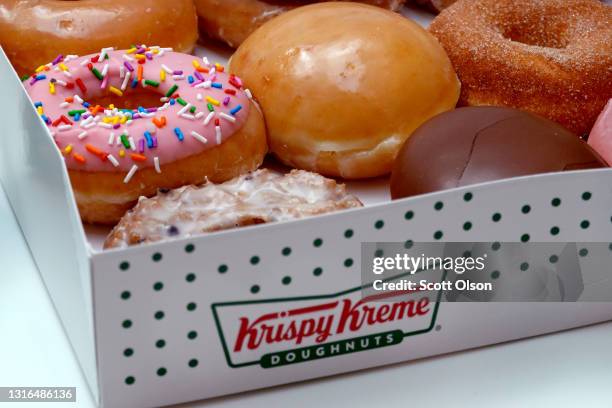 Doughnuts are sold at a Krispy Kreme store on May 05, 2021 in Chicago, Illinois. The doughnut chain reported yesterday that it plans to take the...