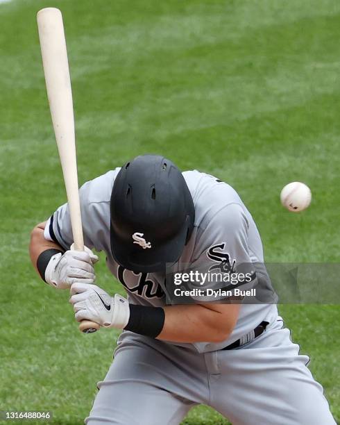 Andrew Vaughn of the Chicago White Sox is hit by a pitch in the second inning against the Cincinnati Reds at Great American Ball Park on May 05, 2021...