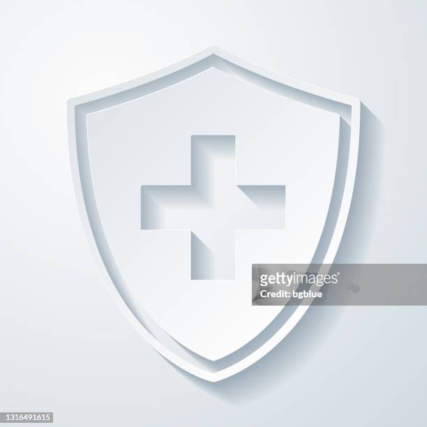 gesundheitsschutzschild. icon mit papierschnitteffekt auf leerem hintergrund - kreuz form stock-grafiken, -clipart, -cartoons und -symbole