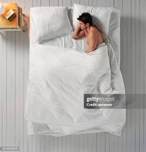 sleeping in bed - bed overhead view stock pictures, royalty-free photos & images