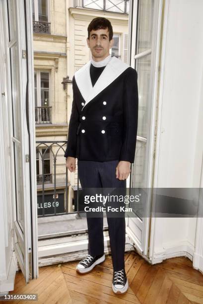 Fashion designer Steven Passaro poses in one of his creations from the Steven Passaro Menswear Collection as part of Caroline Charles Press...