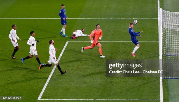 Timo Werner of Chelsea scores his team's first goal as Thibaut Courtois of Real Madrid looks on during the UEFA Champions League Semi Final Second...